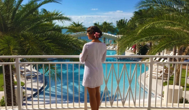 Woman om the terrace with pool view
